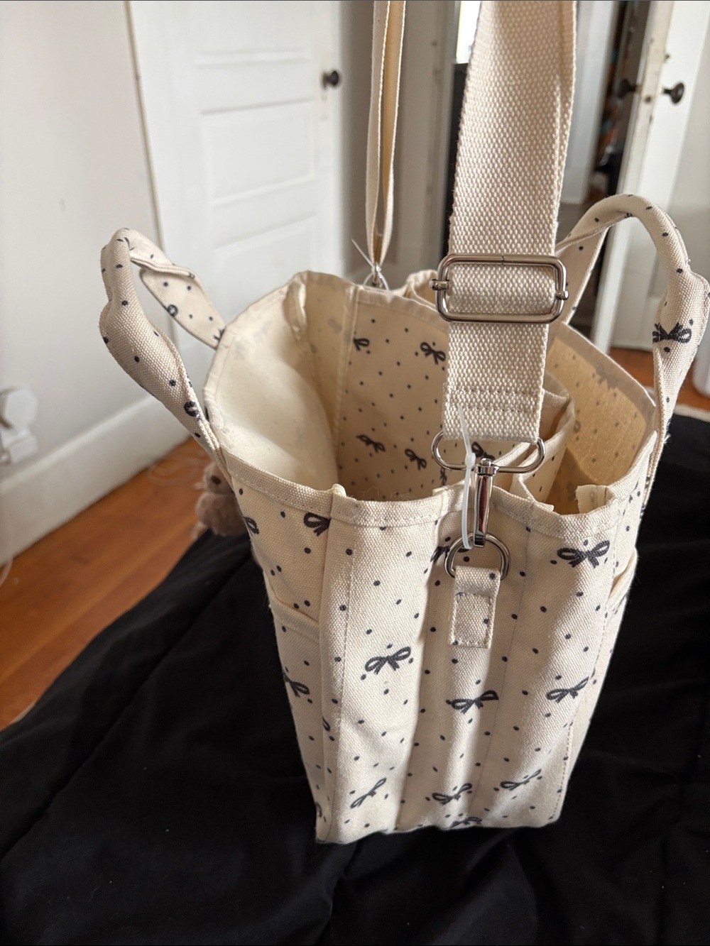 Madden girl. Cream Bow-Print Canvas Tote Bag with Bear Charm. - Picture 10 of 15